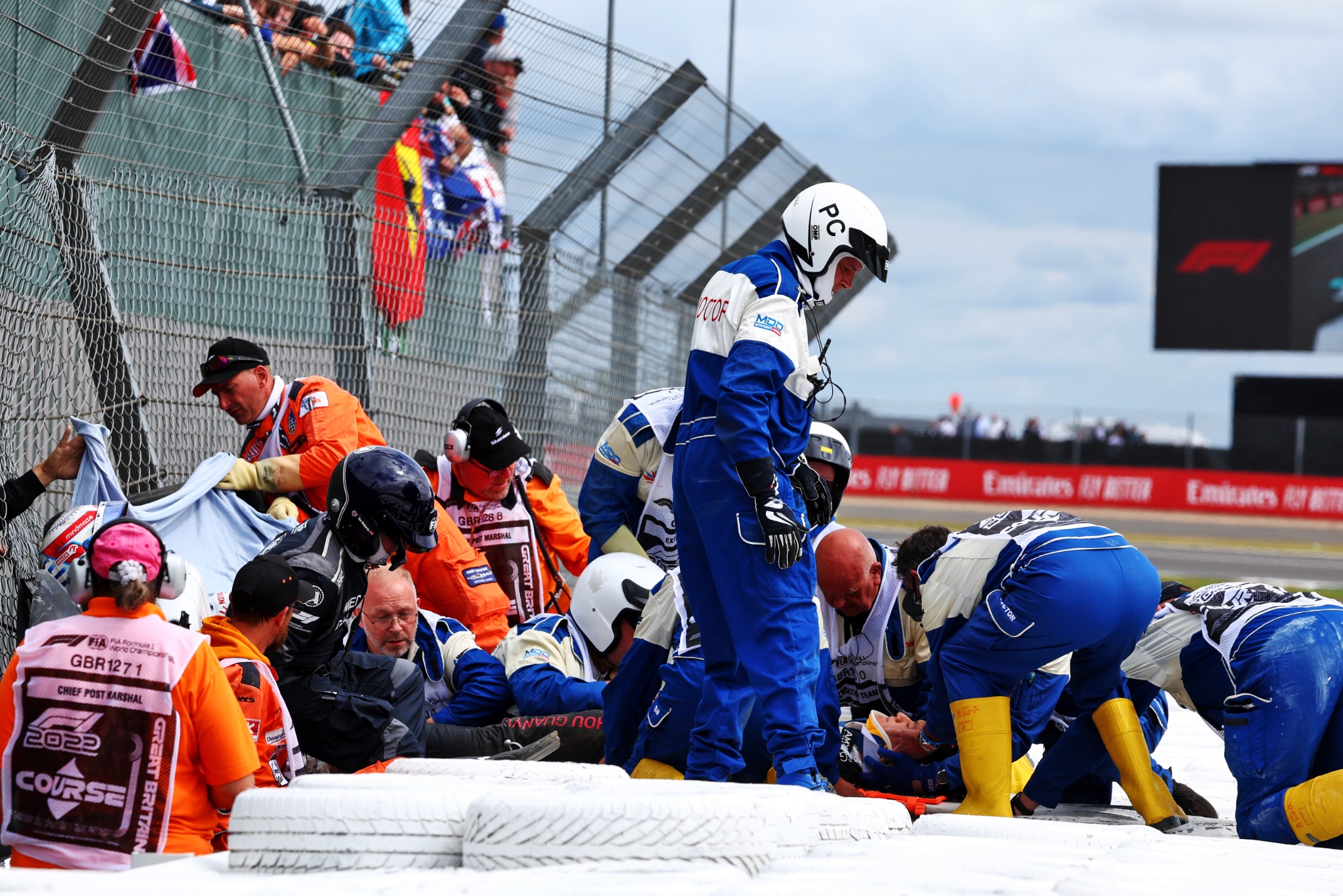 Guanyu Zhou (CHN) Alfa Romeo F1 Team is taken away on a stretcher into an ambulance after he crashed at the start of the
