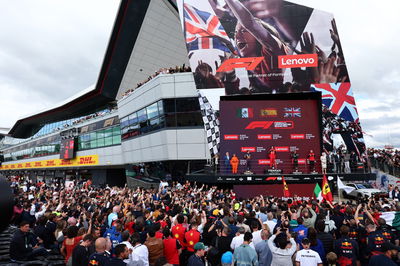 1st place Carlos Sainz Jr (ESP) Ferrari F1-75, with 2nd place Sergio Perez (MEX) Red Bull Racing RB18 and 3rd place Lewis