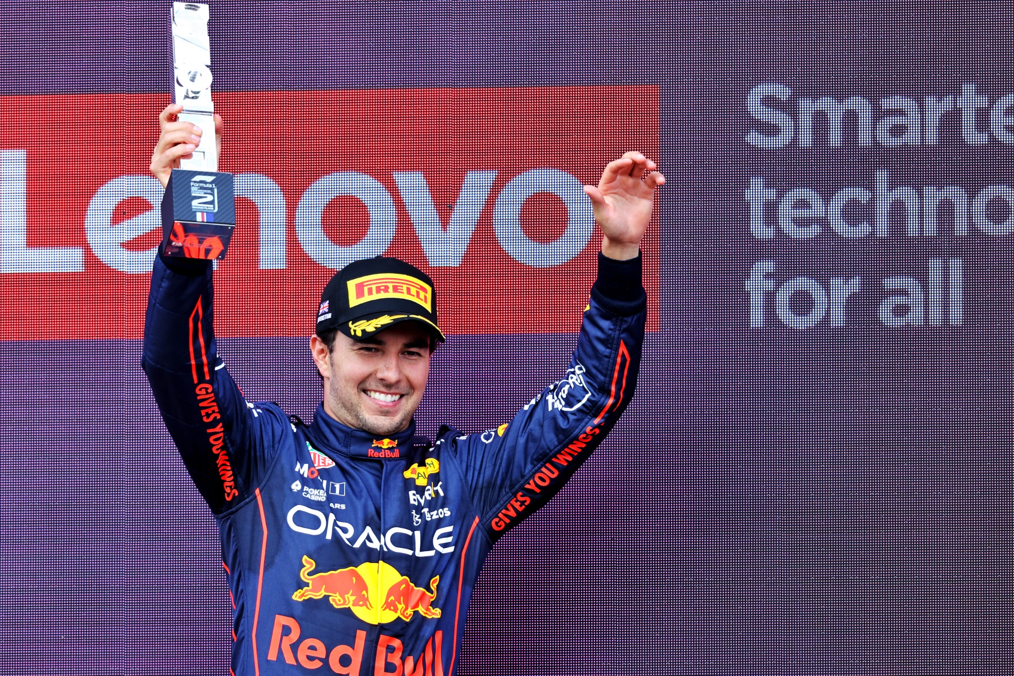 Sergio Perez (MEX) Red Bull Racing celebrates his second position on the podium. Formula 1 World Championship, Rd 10,