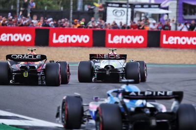 Lewis Hamilton (GBR) Mercedes AMG F1 W13 and Sergio Perez (MEX) Red Bull Racing RB18 battle for position. Formula 1 World