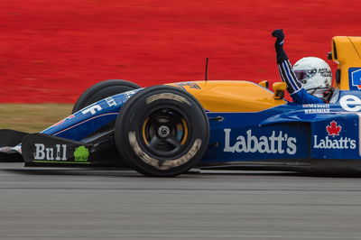 Sebastian Vettel (GER) Aston Martin F1 Team runs his Williams FW14B driven in 1992 by Nigel Mansell (GBR). Formula 1 World