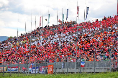 Circuit atmosphere - fans in the grandstands. Formula 1 World Championship, Rd 11, Austrian Grand Prix, Spielberg,