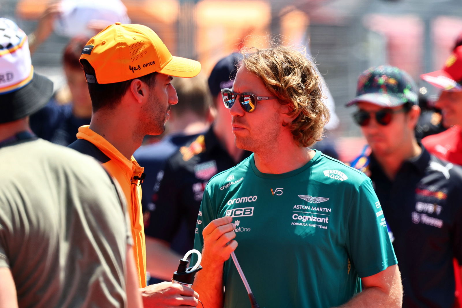 (L to R): Daniel Ricciardo (AUS) McLaren and Sebastian Vettel (GER) Aston Martin F1 Team on the drivers parade. Formula 1