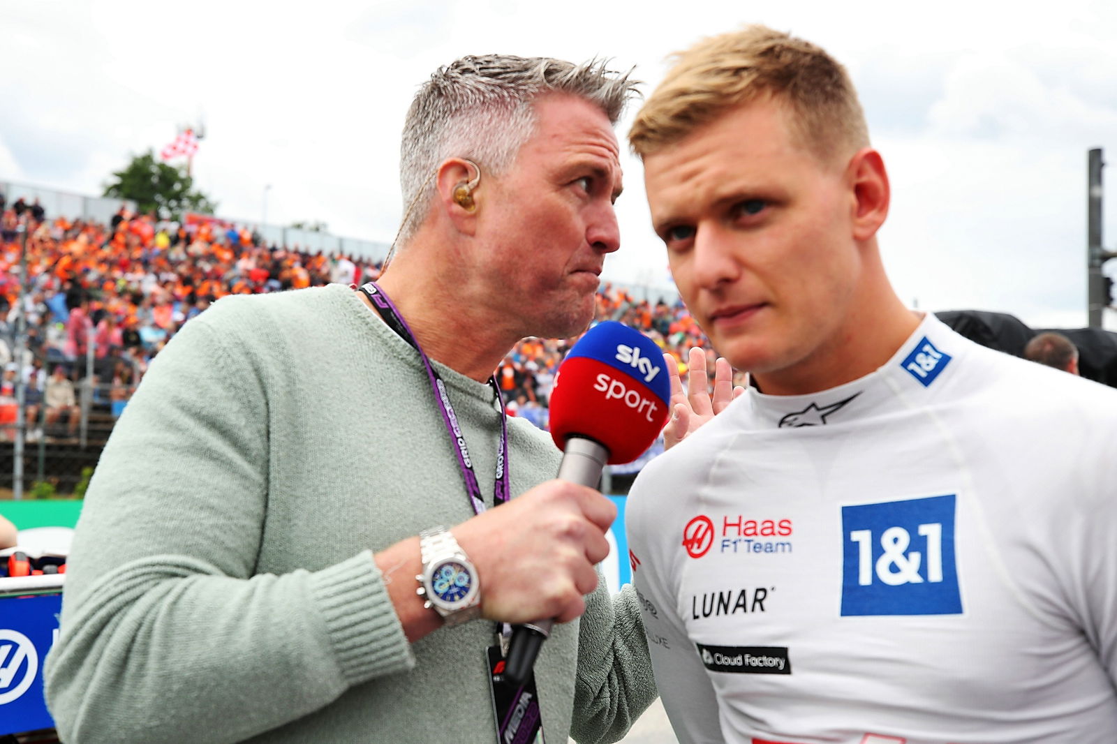 (L to R): Ralf Schumacher (GER) Sky Sport Presenter with Mick Schumacher (GER) Haas F1 Team on the grid. Formula 1 World