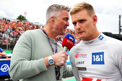 (L to R): Ralf Schumacher (GER) Sky Sport Presenter with Mick Schumacher (GER) Haas F1 Team on the grid. Formula 1 World