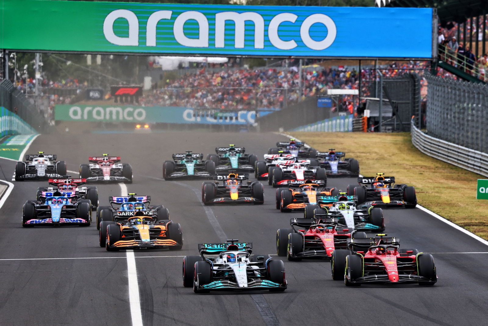 George Russell (GBR) Mercedes AMG F1 W13 leads Carlos Sainz Jr (ESP) Ferrari F1-75 at the start of the race. Formula 1