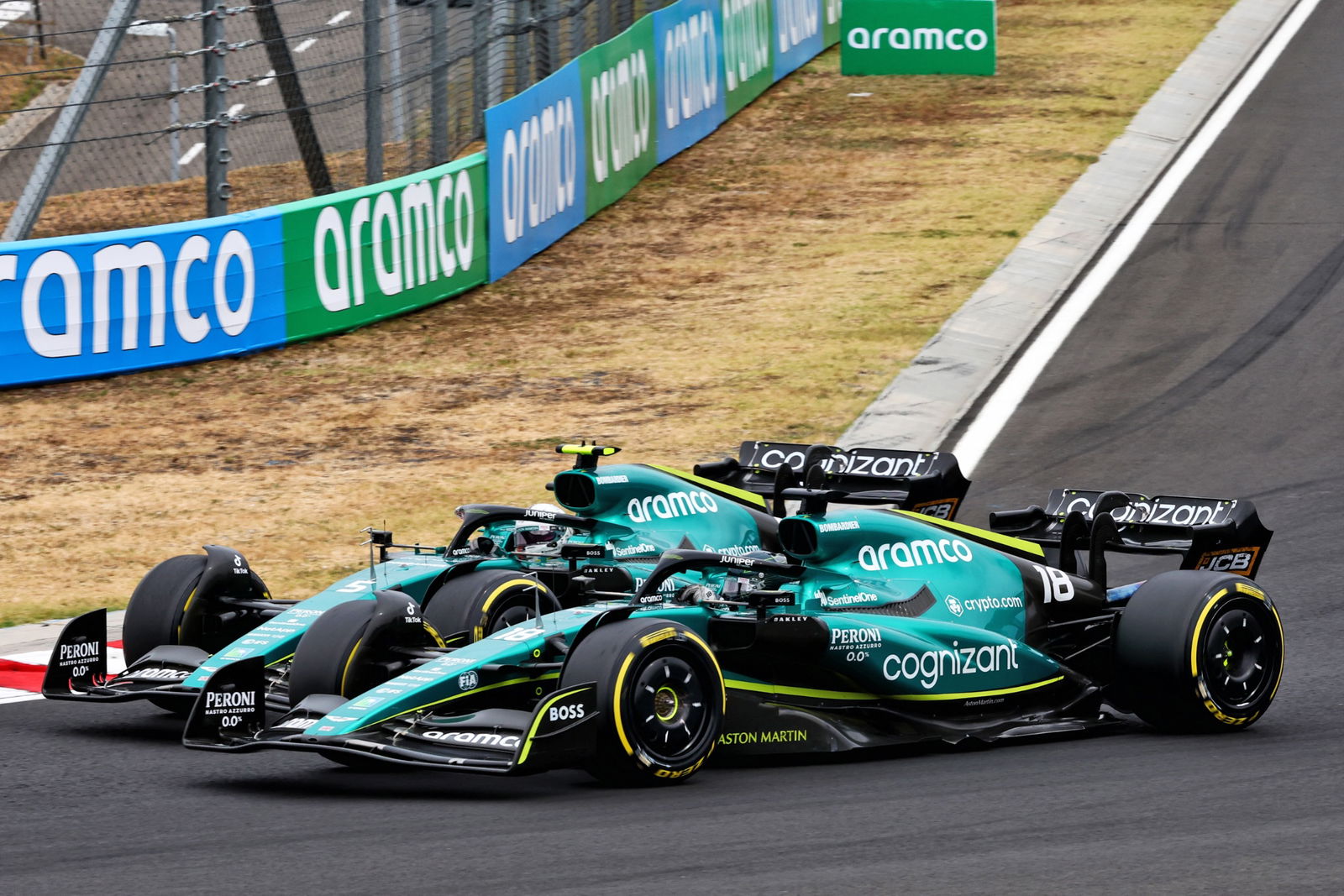 Lance Stroll (CDN) Aston Martin F1 Team AMR22 and team mate Sebastian Vettel (GER) Aston Martin F1 Team AMR22 battle for