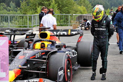 Lewis Hamilton (GBR) Mercedes AMG F1 takes a look at the Red Bull Racing RB18 of Max Verstappen (NLD) Red Bull Racing.
