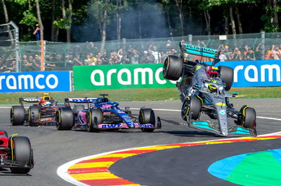 Lewis Hamilton (GBR) Mercedes AMG F1 W13 crashes with Fernando Alonso (ESP) Alpine F1 Team A522 at the start of the race.