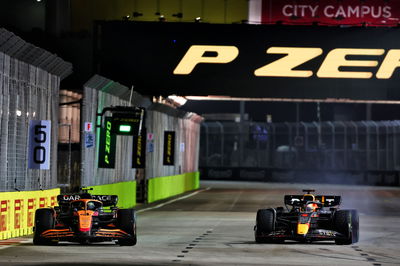 (L to R): Lando Norris (GBR) McLaren MCL36 and Max Verstappen (NLD) Red Bull Racing RB18 battle for position. Formula 1