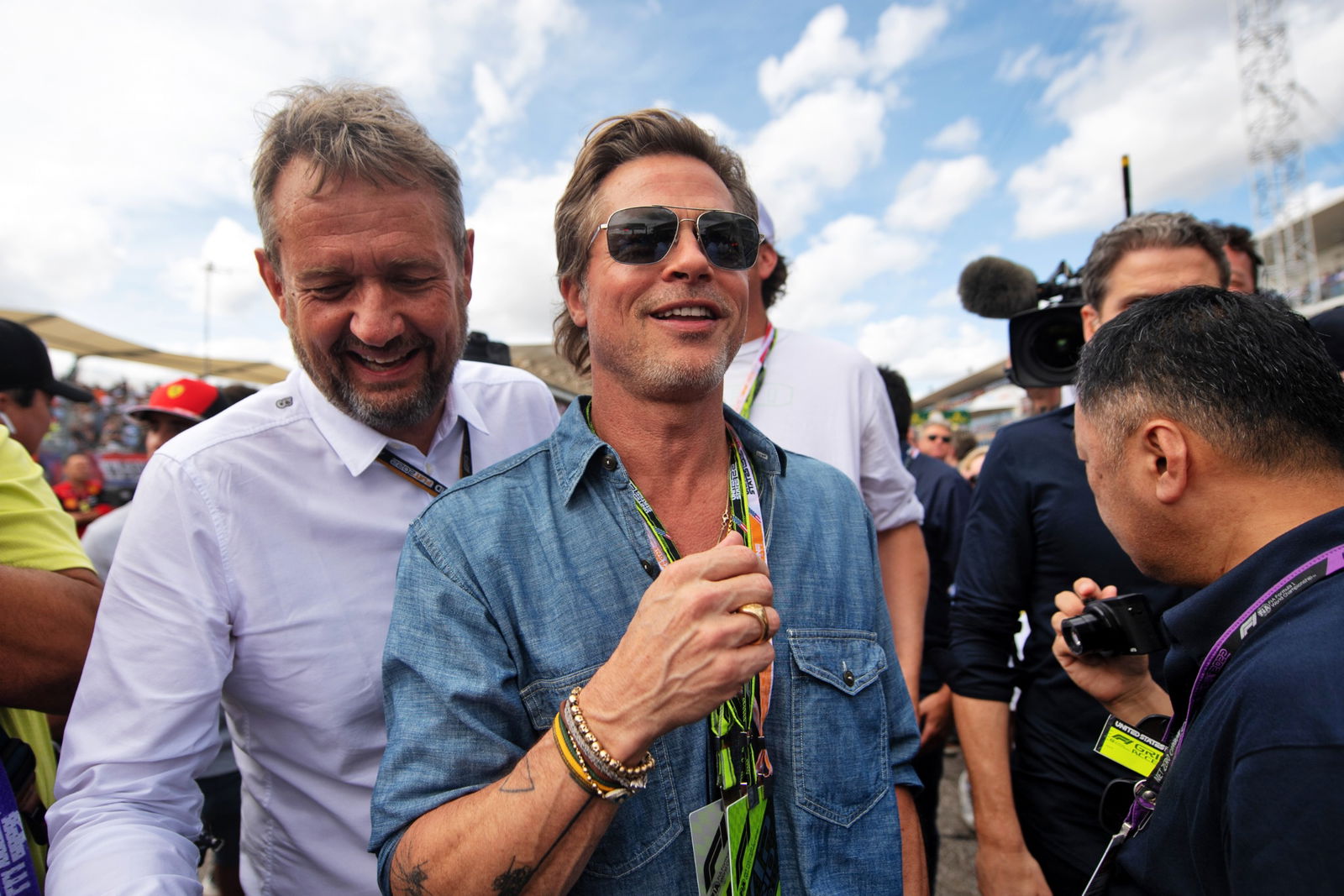 Brad Pitt (USA) Actor with Steve Nielsen (GBR) FOM Sporting Director on the grid. Formula 1 World Championship, Rd 19,