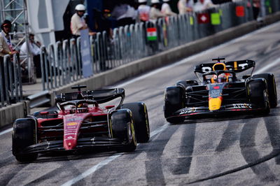 Charles Leclerc (MON) Ferrari F1-75 and Max Verstappen (NLD) Red Bull Racing RB18. Formula 1 World Championship, Rd 19,