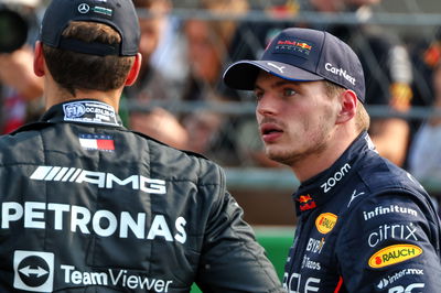 (L to R): George Russell (GBR) Mercedes AMG F1 with pole sitter Max Verstappen (NLD) Red Bull Racing in qualifying parc