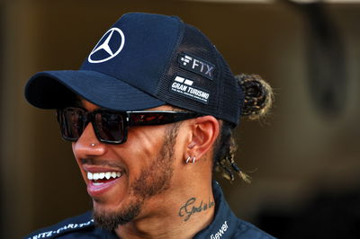 Lewis Hamilton (GBR) Mercedes AMG F1 at a team photograph - the bankrupt FTX branding still showing on his cap. Formula 1