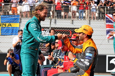 Sebastian Vettel (GER) Aston Martin F1 Team with Daniel Ricciardo (AUS) McLaren at the drivers end of season group