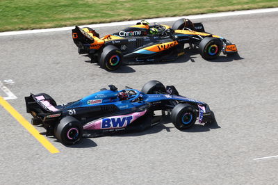 Esteban Ocon (FRA) Alpine F1 Team A523 and Lando Norris (GBR) McLaren MCL60. Formula 1 Testing, Sakhir, Bahrain, Day