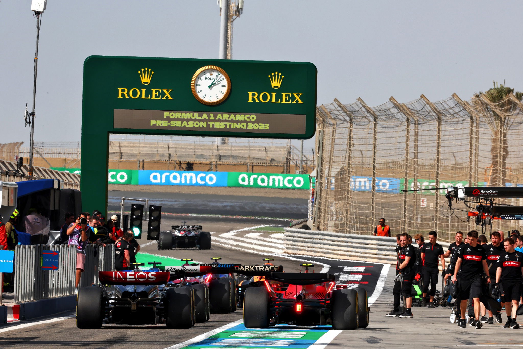 Lewis Hamilton (GBR) Mercedes AMG F1 W14 and Carlos Sainz Jr (ESP) Ferrari SF-23 in the pits. Formula 1 Testing, Sakhir,