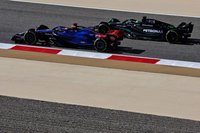 Alexander Albon (THA) Williams Racing FW45 and Lewis Hamilton (GBR) Mercedes AMG F1 W14. Formula 1 World Championship, Rd