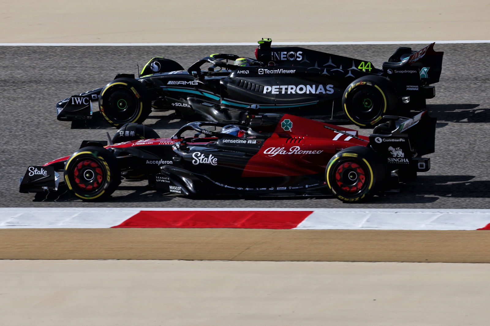 Valtteri Bottas (FIN) Alfa Romeo F1 Team C43 and Lewis Hamilton (GBR) Mercedes AMG F1 W14. Formula 1 World Championship,