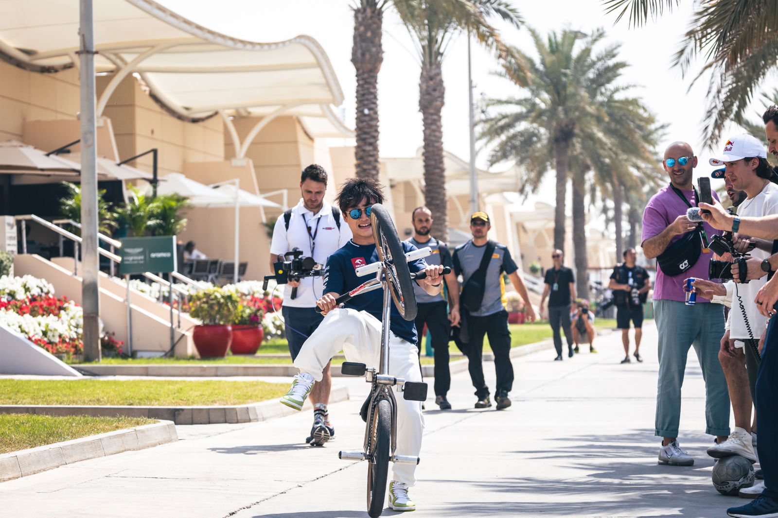 Yuki Tsunoda (JPN) AlphaTauri on a BMX bike. Formula 1 World Championship, Rd 1, Bahrain Grand Prix, Sakhir, Bahrain,