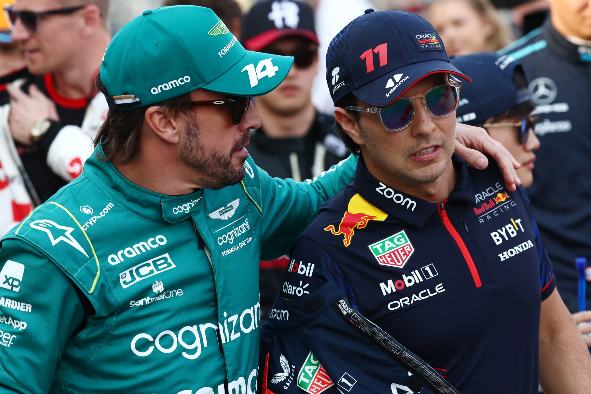 (L to R): Fernando Alonso (ESP) Aston Martin F1 Team and Sergio Perez (MEX) Red Bull Racing on the drivers' parade.