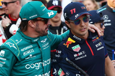 (L to R): Fernando Alonso (ESP) Aston Martin F1 Team and Sergio Perez (MEX) Red Bull Racing on the drivers' parade.