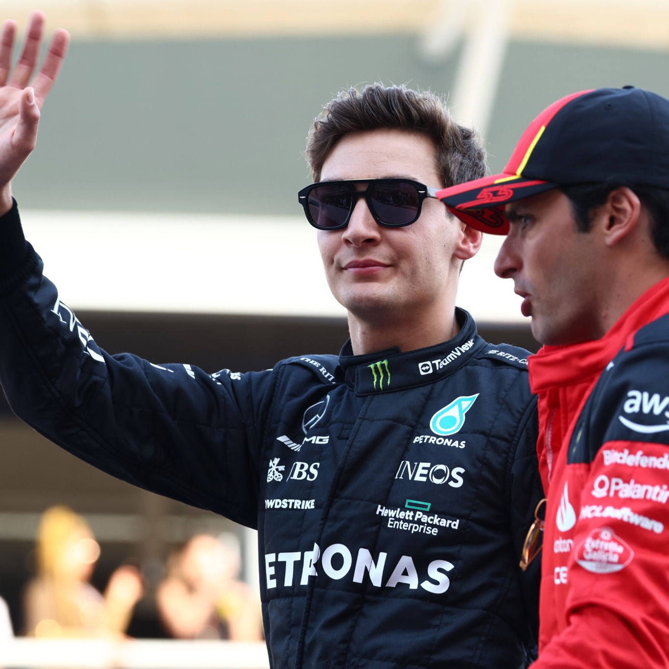 (L to R): George Russell (GBR) Mercedes AMG F1 and Carlos Sainz Jr (ESP) Ferrari on the drivers' parade. Formula 1 World