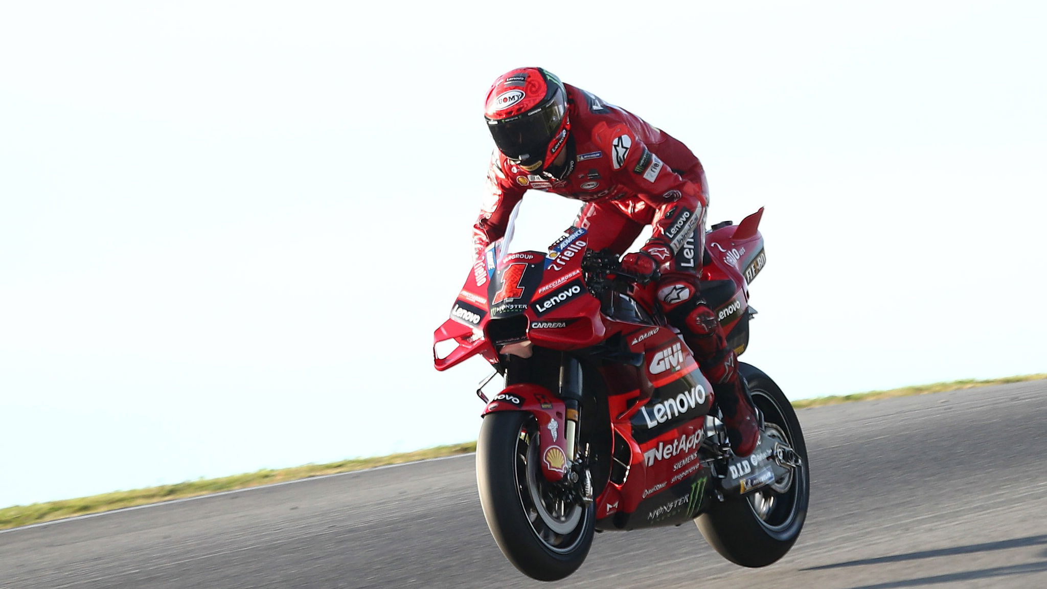 Francesco Bagnaia, both wheels in the air, Portimao MotoGP test, 11 March