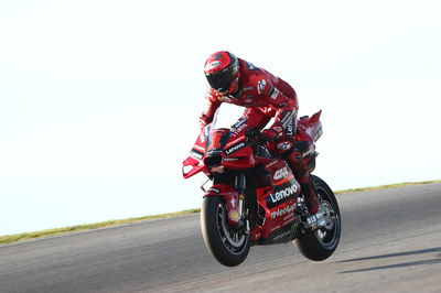 Francesco Bagnaia, both wheels in the air, Portimao MotoGP test, 11 March