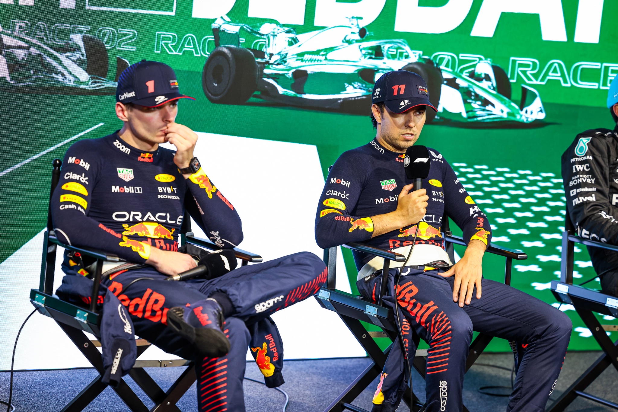 (L to R): Max Verstappen (NLD) Red Bull Racing and race winner Sergio Perez (MEX) Red Bull Racing in the the post race FIA