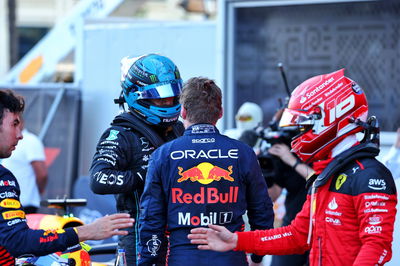 (L to R): George Russell (GBR) Mercedes AMG F1 and Max Verstappen (NLD) Red Bull Racing discuss the Sprint race in parc