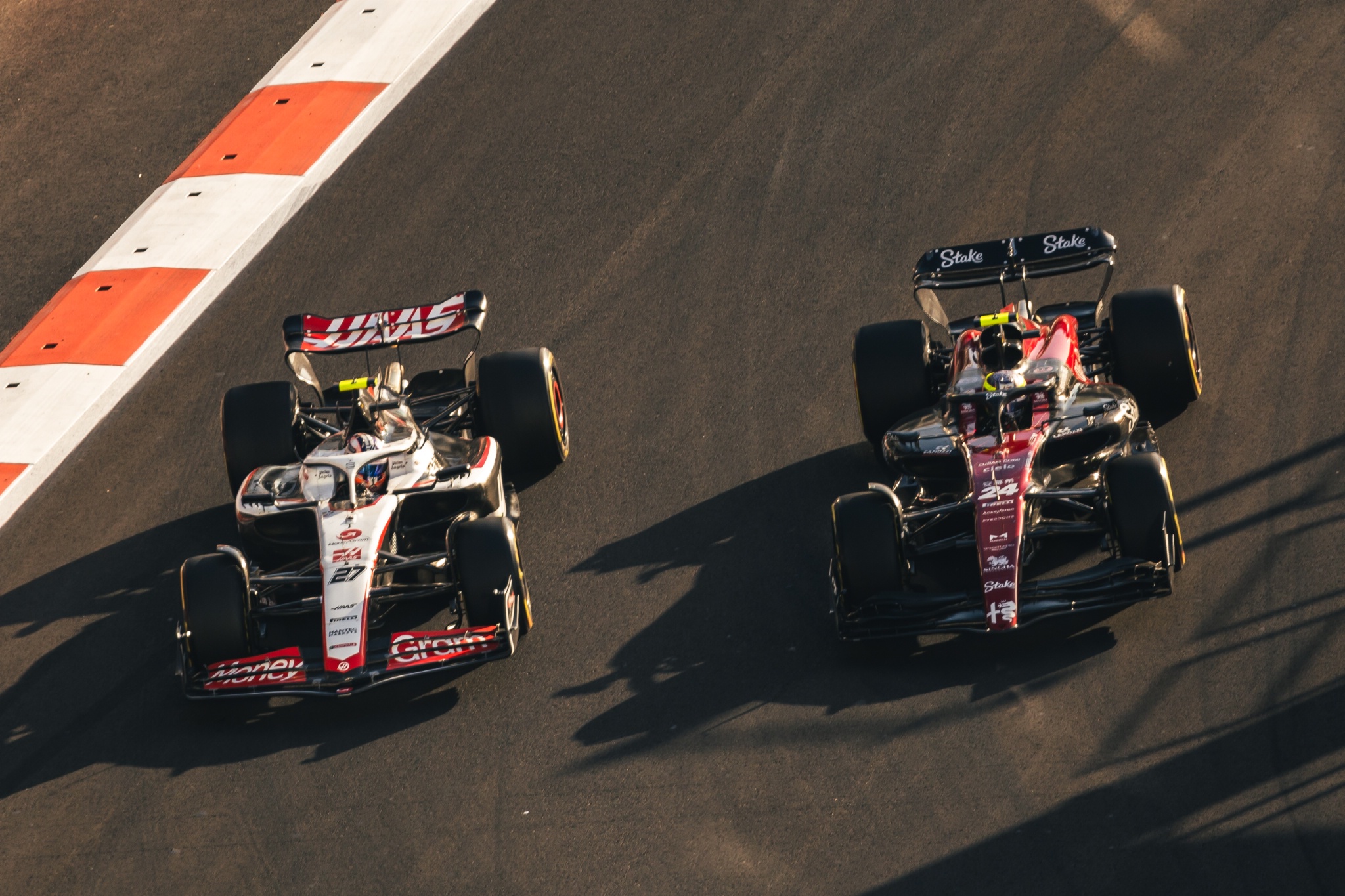 Nico Hulkenberg (GER) Haas VF-23 and Zhou Guanyu (CHN) Alfa Romeo F1 Team C43 battle for position. Formula 1 World