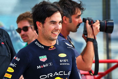 Sergio Perez (MEX) Red Bull Racing celebrates his pole position in qualifying parc ferme. Formula 1 World Championship, Rd