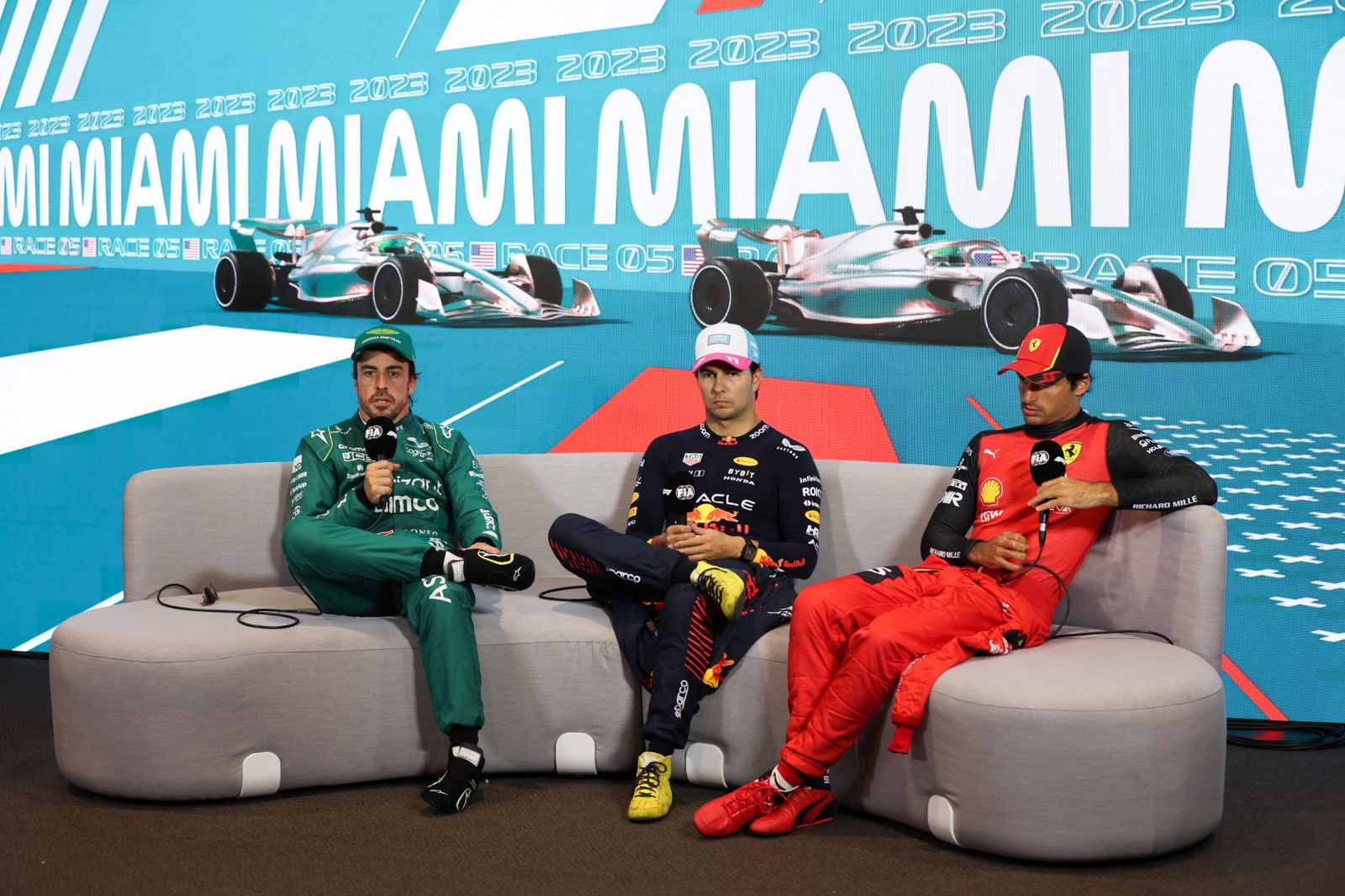 (L to R): Fernando Alonso (ESP) Aston Martin F1 Team; Sergio Perez (MEX) Red Bull Racing; and Carlos Sainz Jr (ESP) Ferrari,