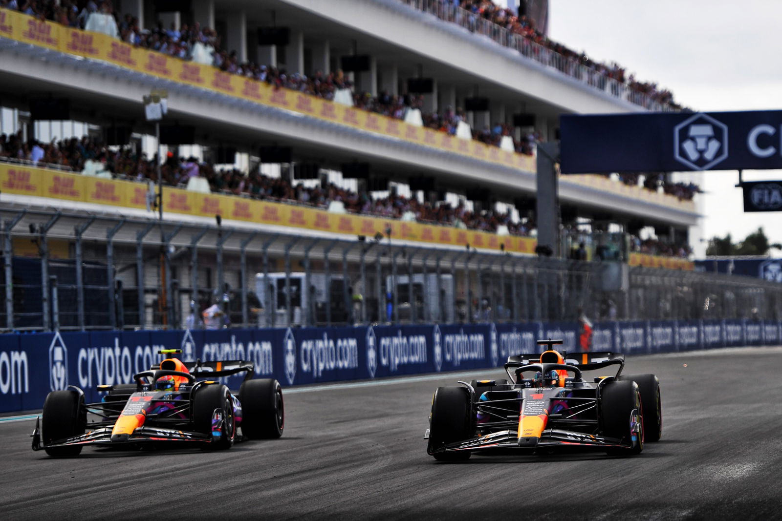 (L to R): Sergio Perez (MEX) Red Bull Racing RB19 and Max Verstappen (NLD) Red Bull Racing RB19 battle for the lead of the