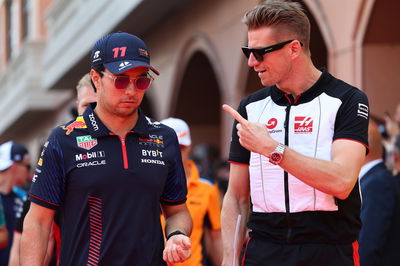 (L to R): Sergio Perez (MEX) Red Bull Racing with Nico Hulkenberg (GER) Haas F1 Team on the drivers' parade. Formula 1