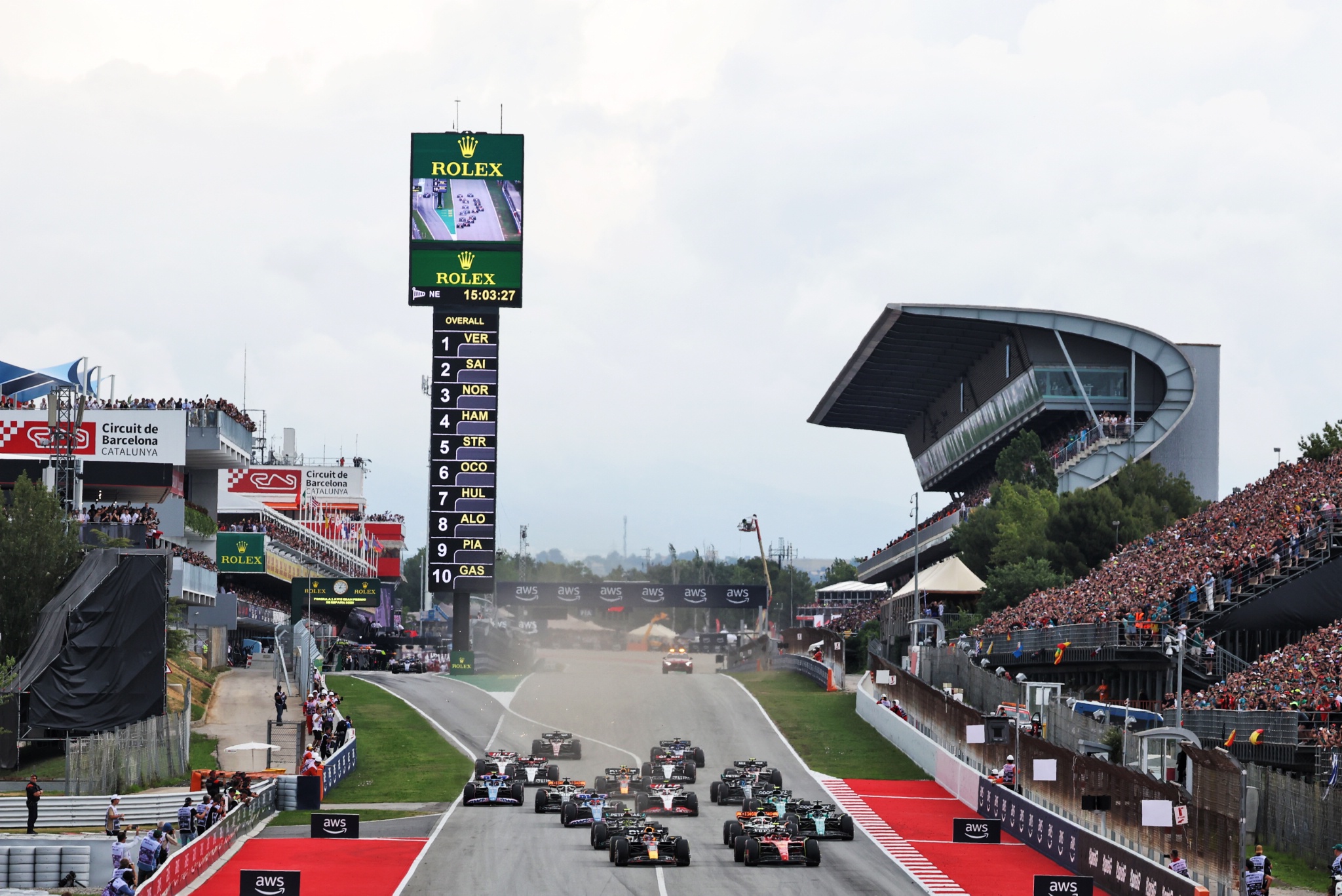 Max Verstappen (NLD) Red Bull Racing RB19 and Carlos Sainz Jr (ESP) Ferrari SF-23 battle for the lead at the start of the