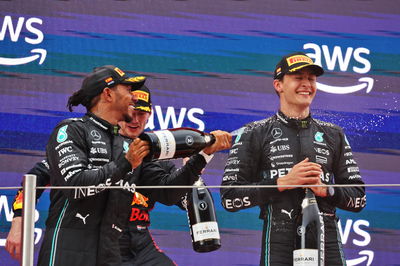 (L to R): Lewis Hamilton (GBR) Mercedes AMG F1 celebrates his second position on the podium with third placed team mate