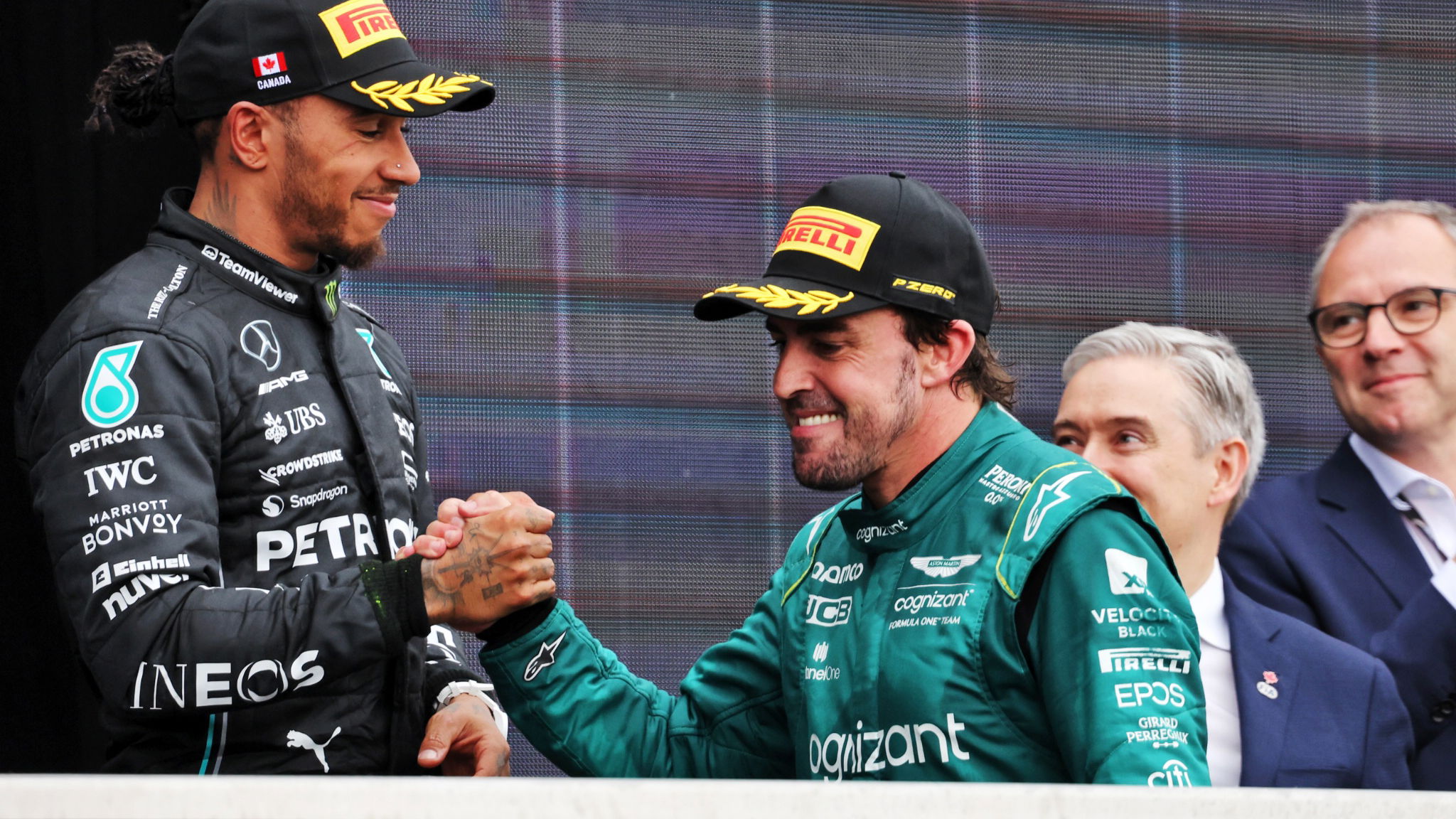 Fernando Alonso (ESP) Aston Martin F1 Team celebrates his second position with third placed Lewis Hamilton (GBR) Mercedes