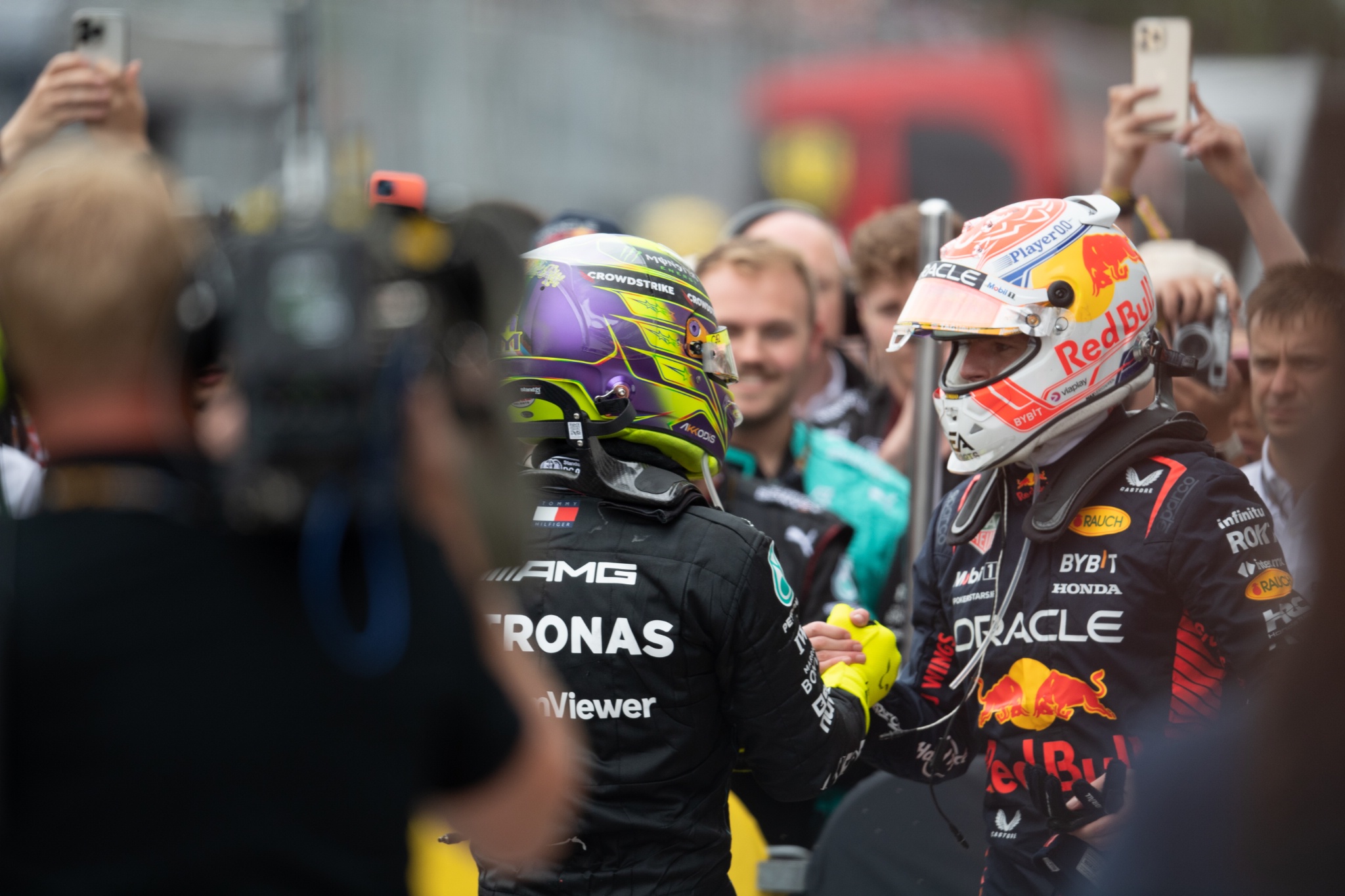 (L to R): Lewis Hamilton (GBR) Mercedes AMG F1 celebrates in parc ferme with race winner Max Verstappen (NLD) Red Bull