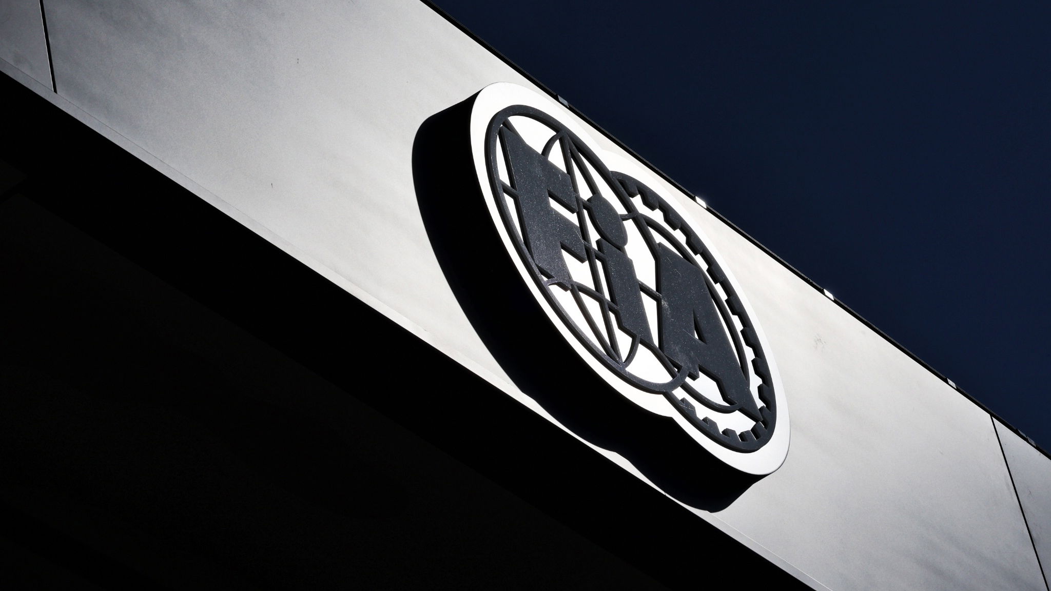 FIA Logo in the paddock. Form