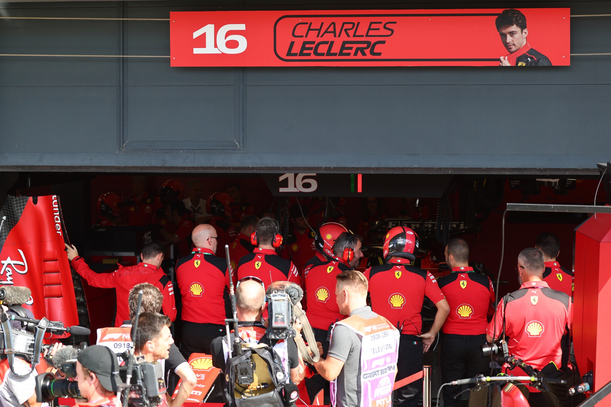 Ferrari mechanics surround the Ferrari SF-23 of Charles Leclerc (MON) Ferrari in the pit garage. Formula 1 World
