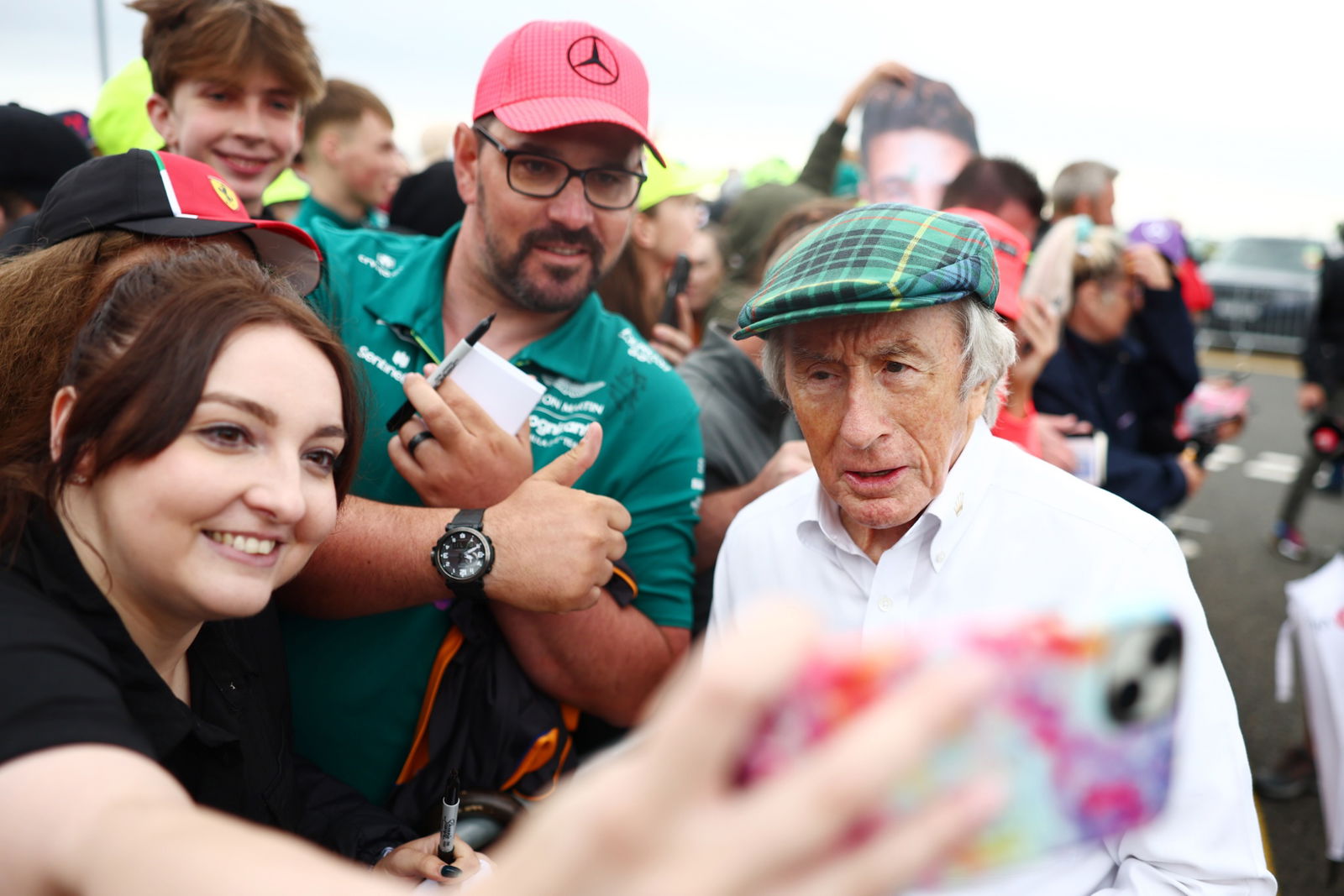 Jackie Stewart (GBR) with fans. Formula 1 World Championship, Rd 11, British Grand Prix, Silverstone, England, Race Day.