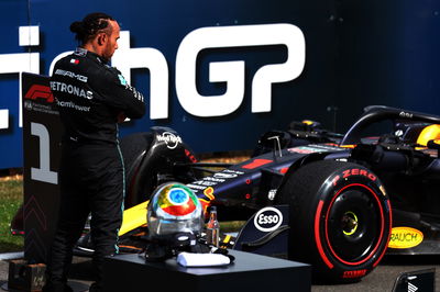 Lewis Hamilton (GBR) Mercedes AMG F1 W14 looks at the Red Bull Racing RB19 in parc ferme. Formula 1 World Championship, Rd