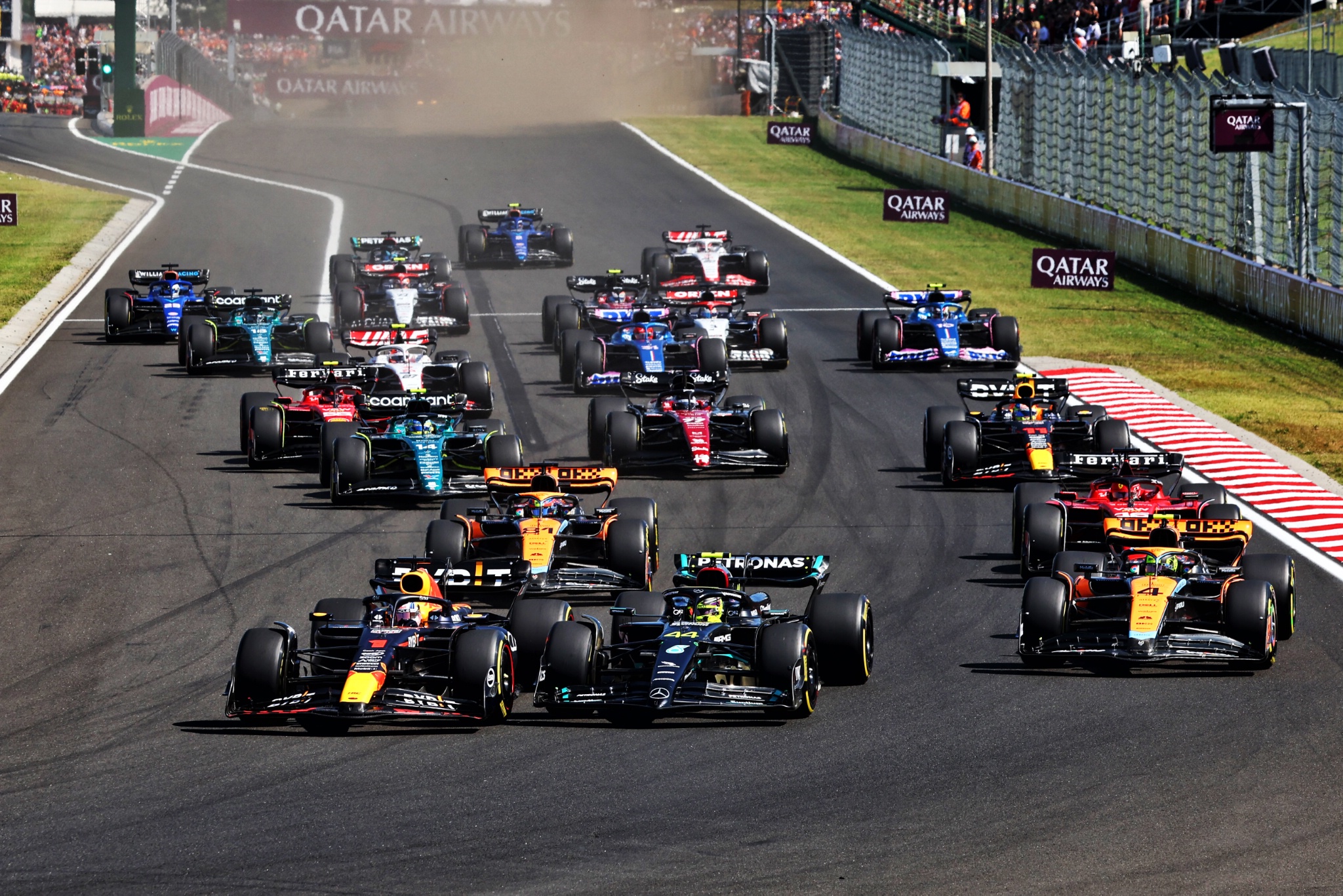 Max Verstappen (NLD) Red Bull Racing RB19 leads Lewis Hamilton (GBR) Mercedes AMG F1 W14 at the start of the race. Formula