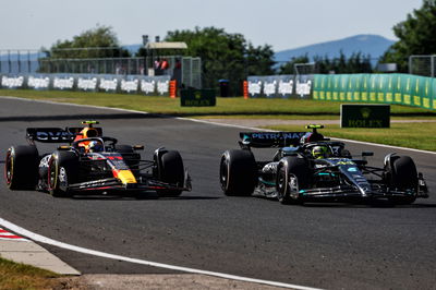 Sergio Perez (MEX) Red Bull Racing RB19 and Lewis Hamilton (GBR) Mercedes AMG F1 W14 battle for position. Formula 1 World