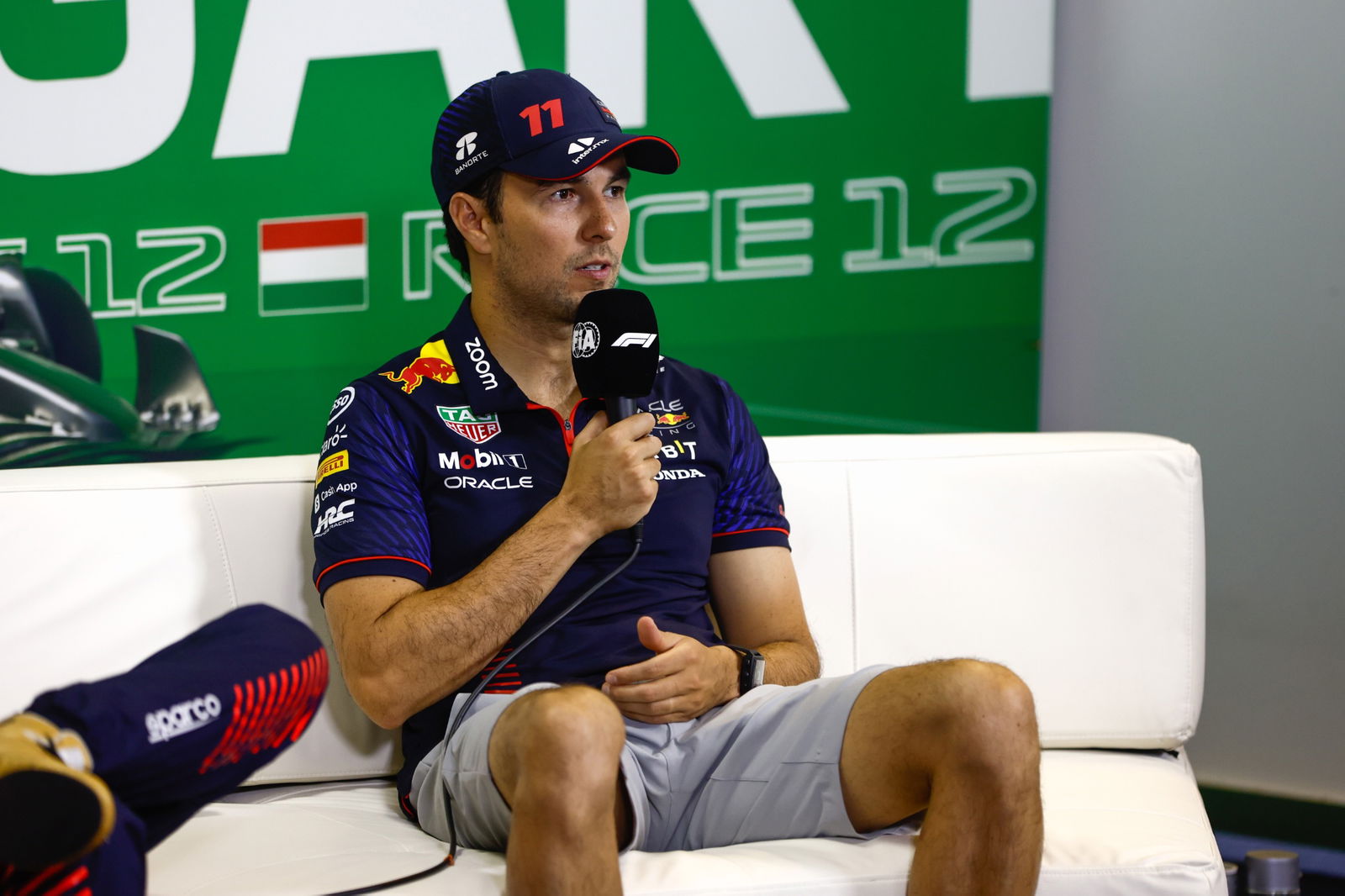 Sergio Perez (MEX) Red Bull Racing, in the post race FIA Press Conference. Formula 1 World Championship, Rd 12, Hungarian