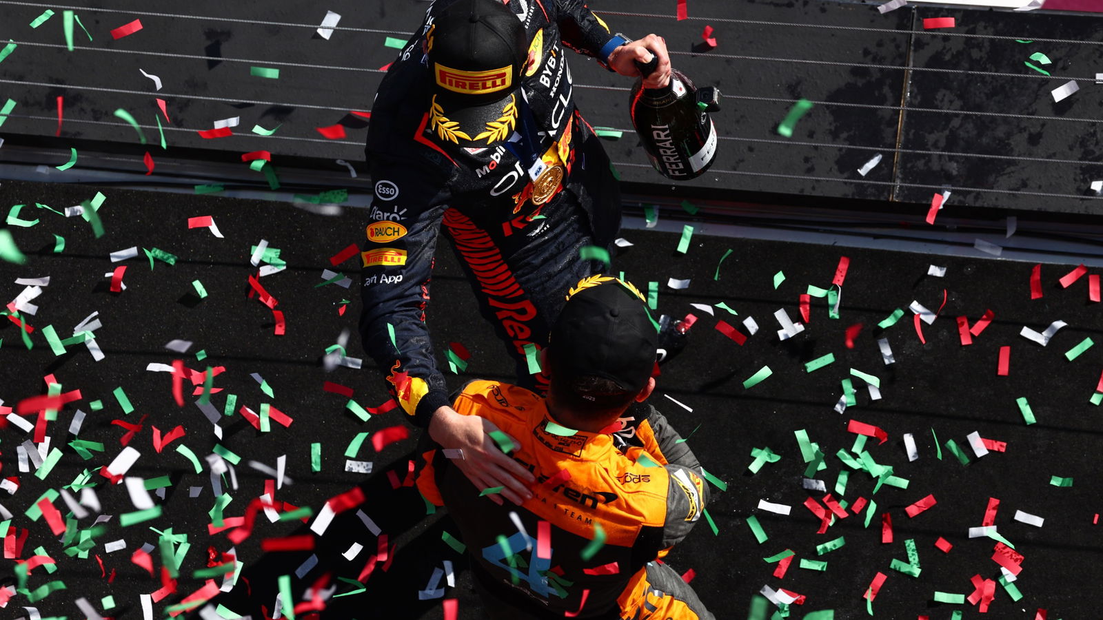 Race winner Max Verstappen (NLD) Red Bull Racing celebrates on the podium with Lando Norris (GBR) McLaren. Formula 1 World