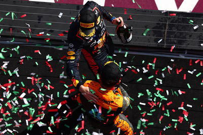 Race winner Max Verstappen (NLD) Red Bull Racing celebrates on the podium with Lando Norris (GBR) McLaren. Formula 1 World