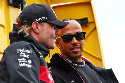 (L to R): Valtteri Bottas (FIN) Alfa Romeo F1 Team with Lewis Hamilton (GBR) Mercedes AMG F1 on the drivers' parade.
